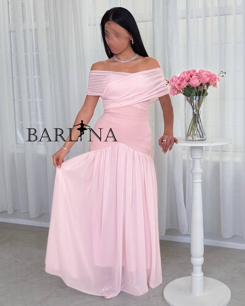 pink dress with a wrap-style off-shoulder cut