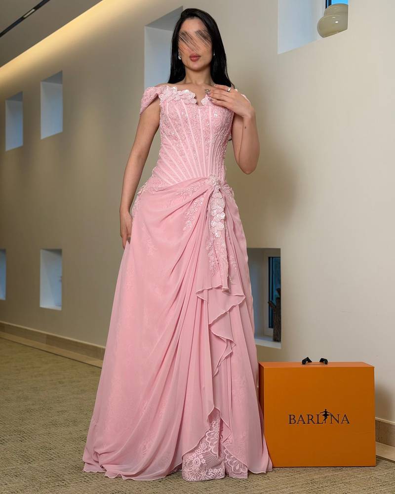 Evening dress with a corset cut and lace embroidery