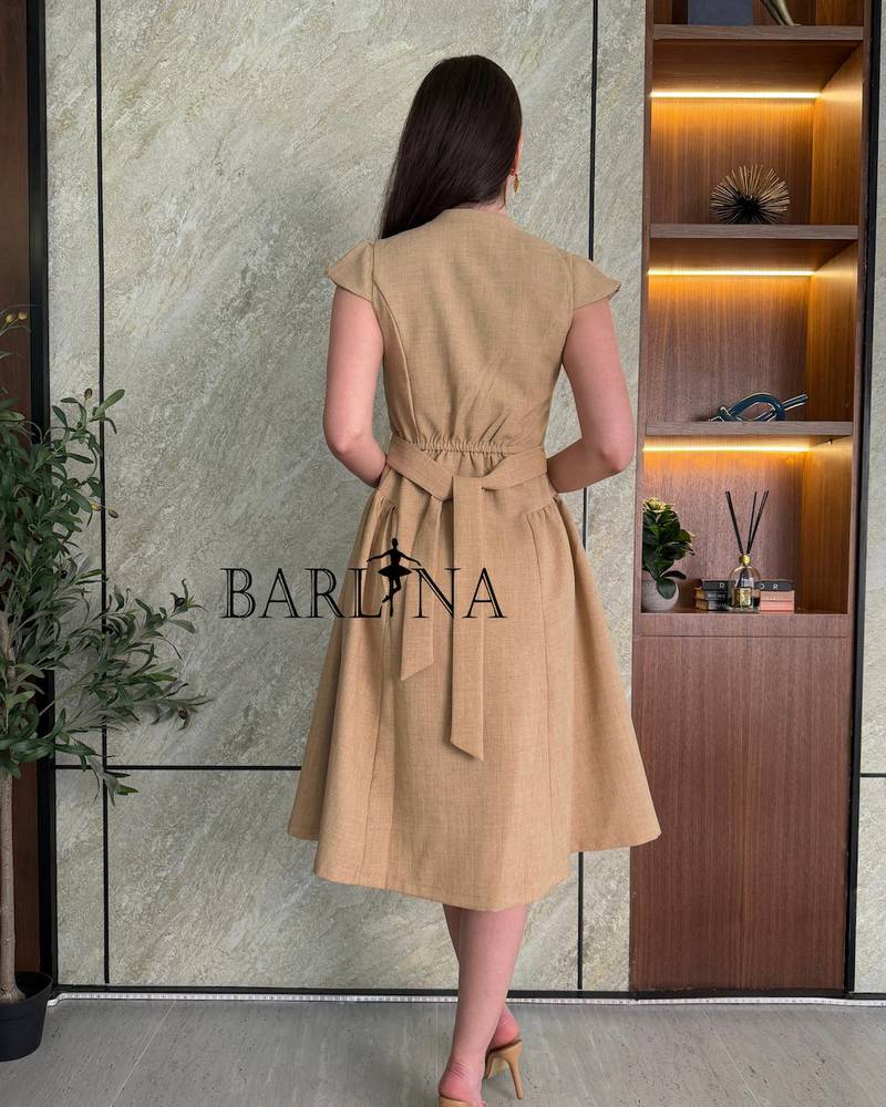 Elegant brown dress with simple embroidery on the waist