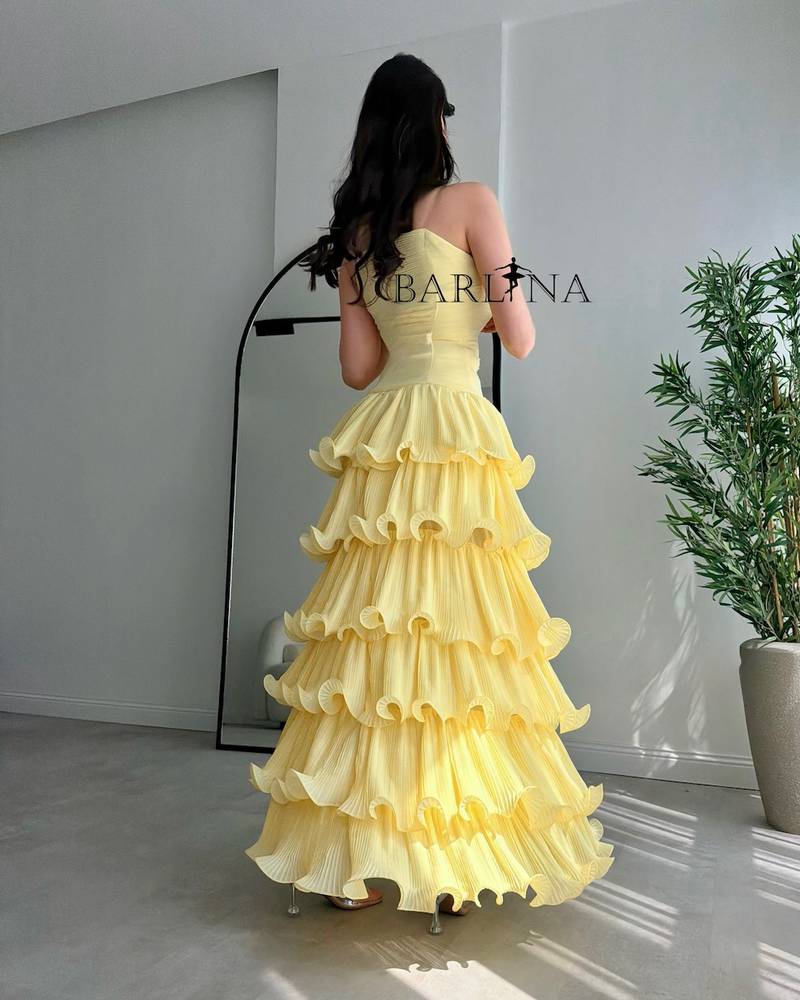 Lemon-yellow dress with ruffled layers
