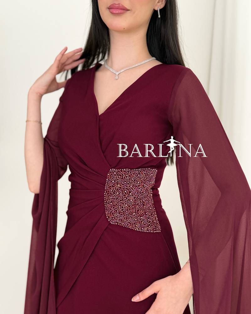 A soft burgundy dress with side embroidery details