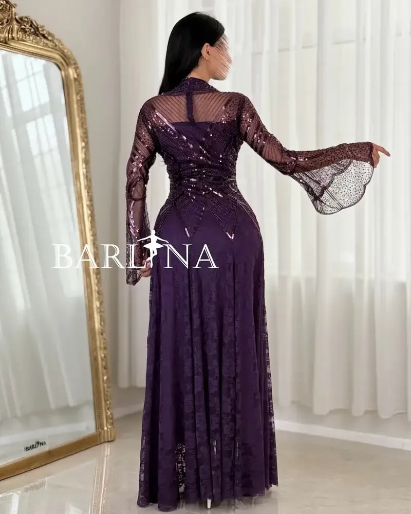 Luxurious purple evening dress with transparent sleeves