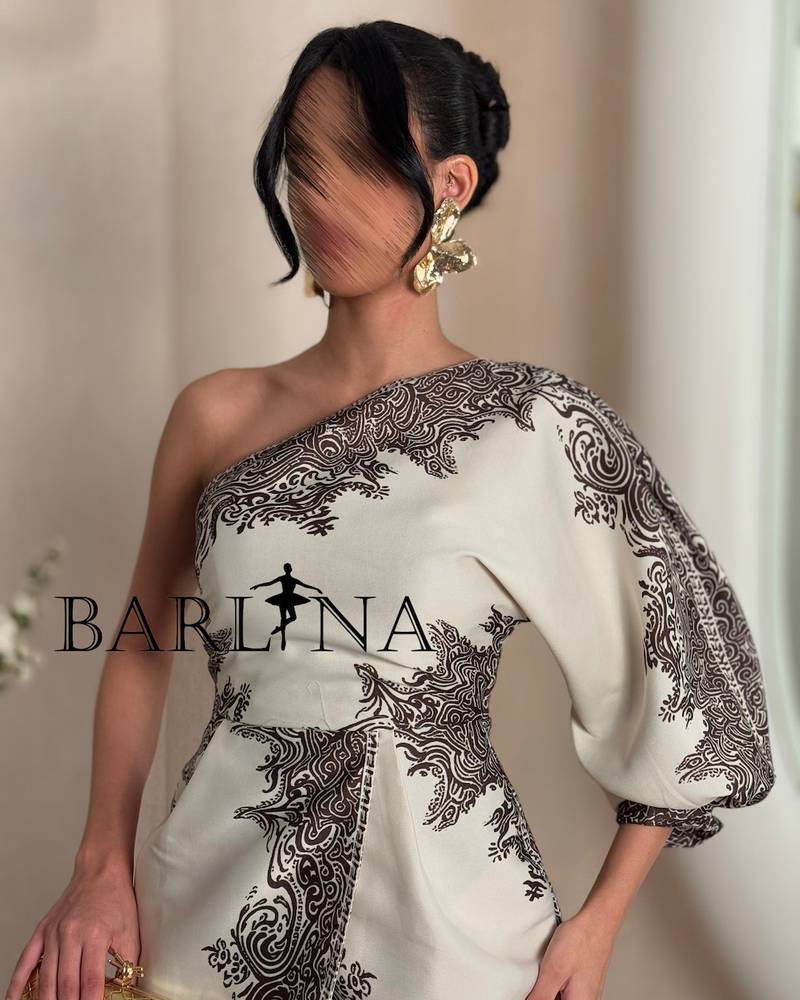 A distinctive one-shoulder dress with decorative patterns