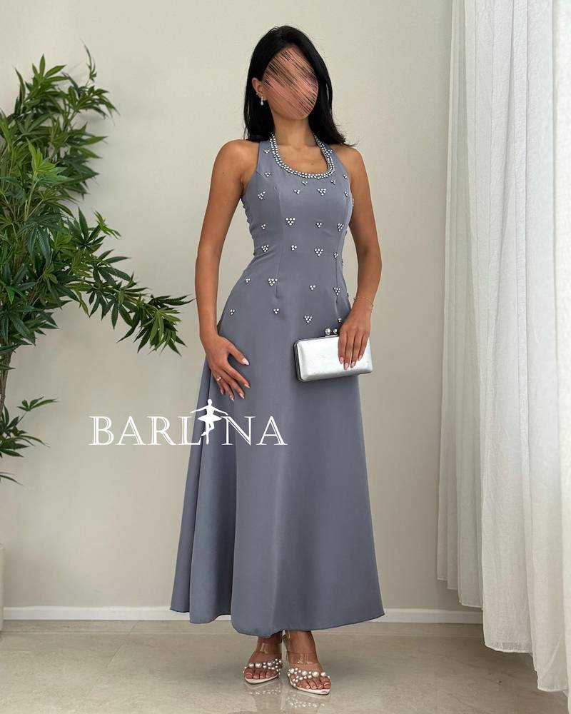 grey halter dress adorned with crystal beads