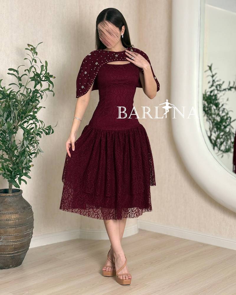 Burgundy lace dress with a feminine cut