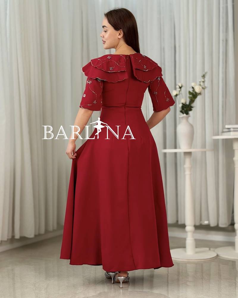 Long red dress with embroidered sleeves