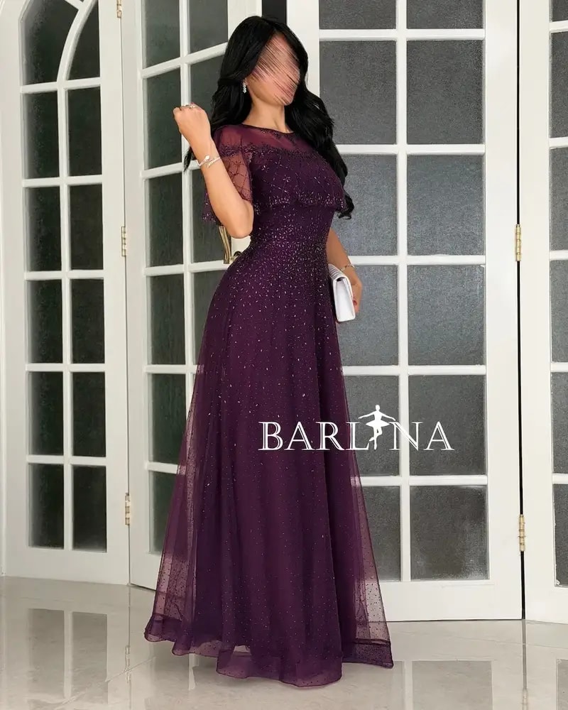 Purple tulle evening dress decorated with sequins