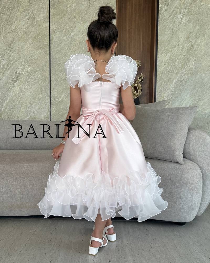 Girls' pink dress with elegant bow and ruffles