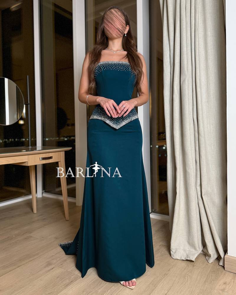 Petrol dress with elegant pearl details