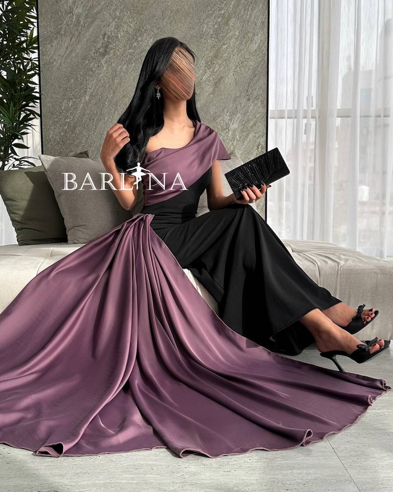 Black evening dress with shoulder and purple shawl