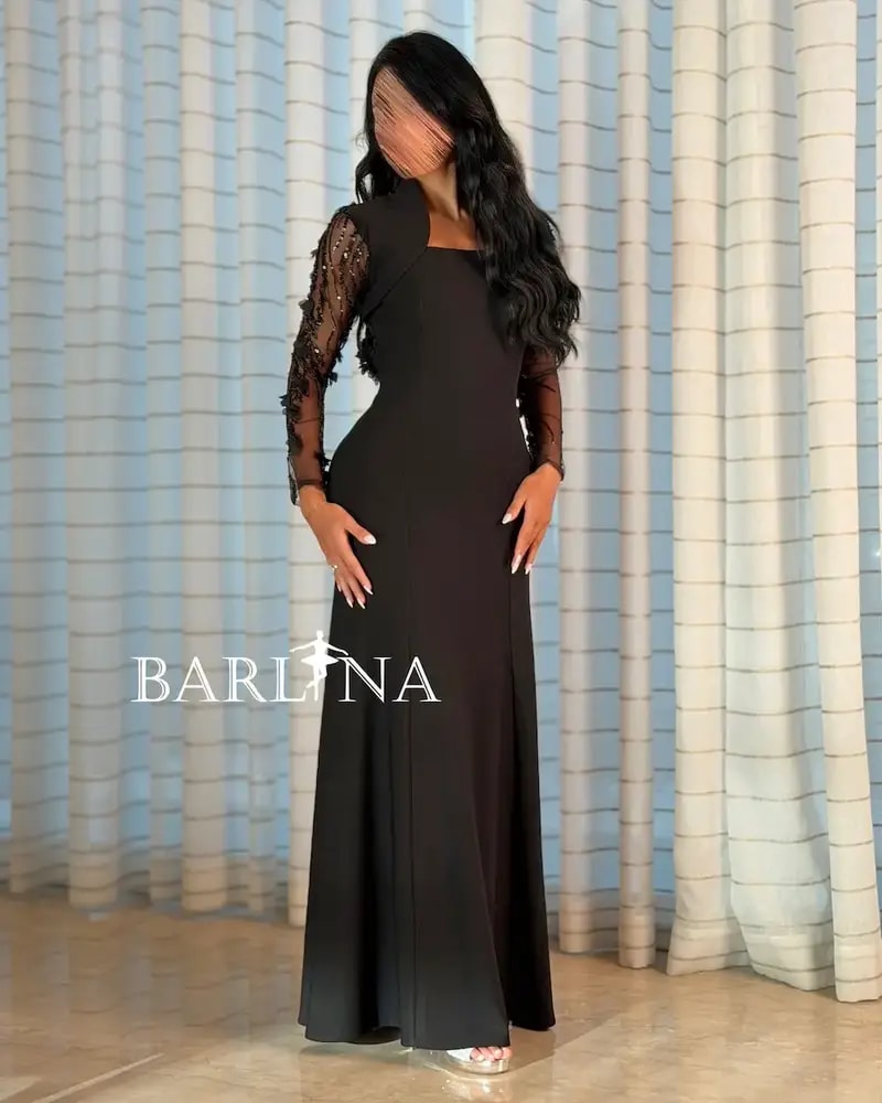 Black dress with sheer sleeves and an open back