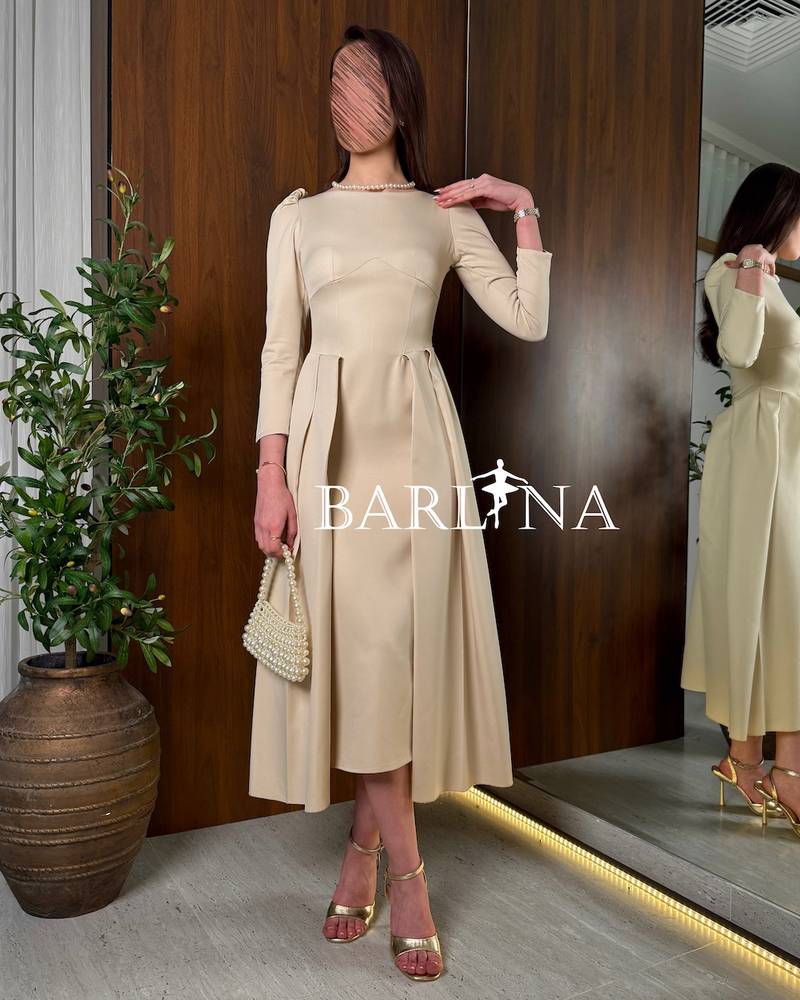 Soft beige midi dress with side pleats