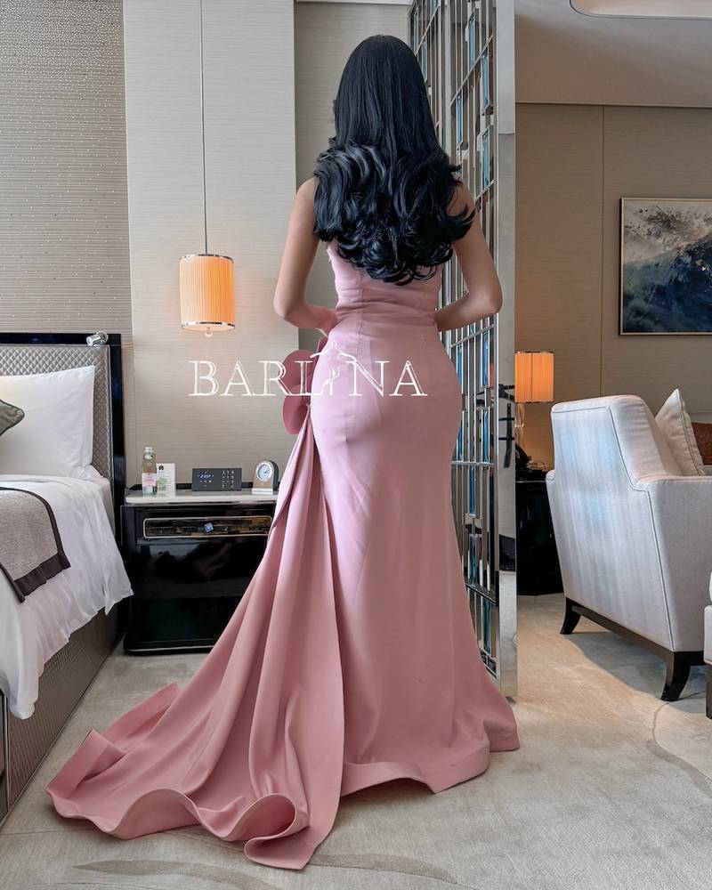 Long pink evening dress with a wide bottom