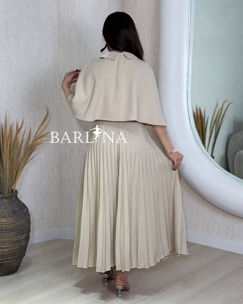 Beige pleated dress with a short flowing cape