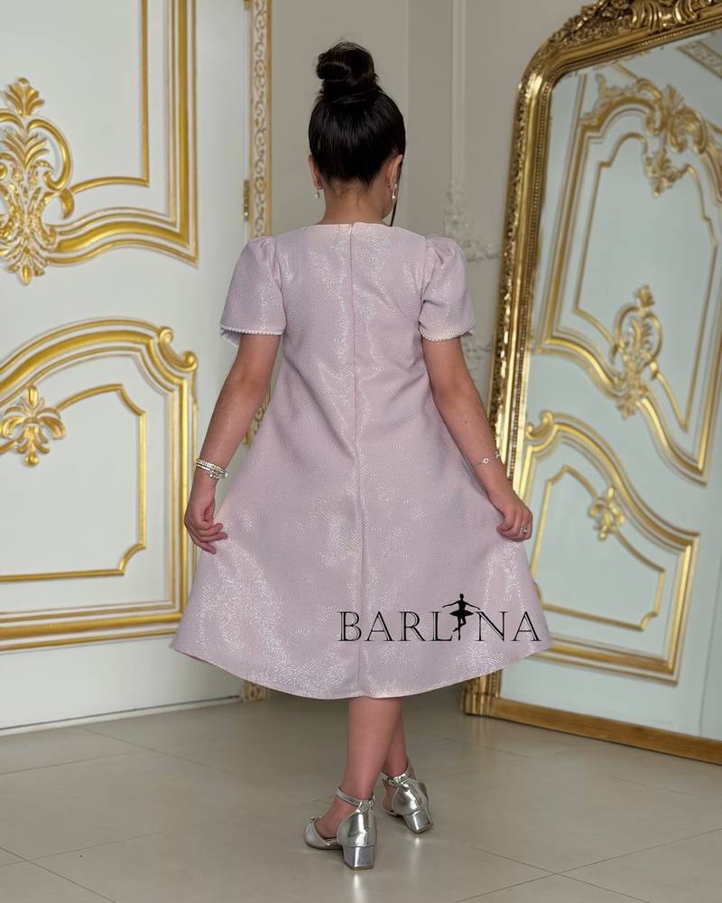 Light mauve girls' dress with white patterns on the chest