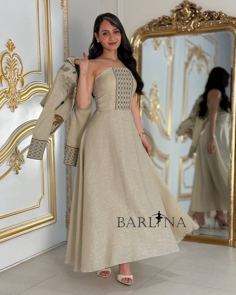 Beige dress with a jacket embroidered with palm trees