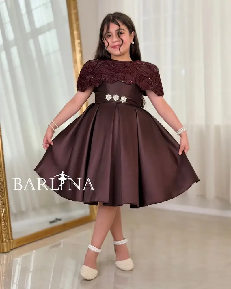 Elegant girls' dress with embellished shoulders