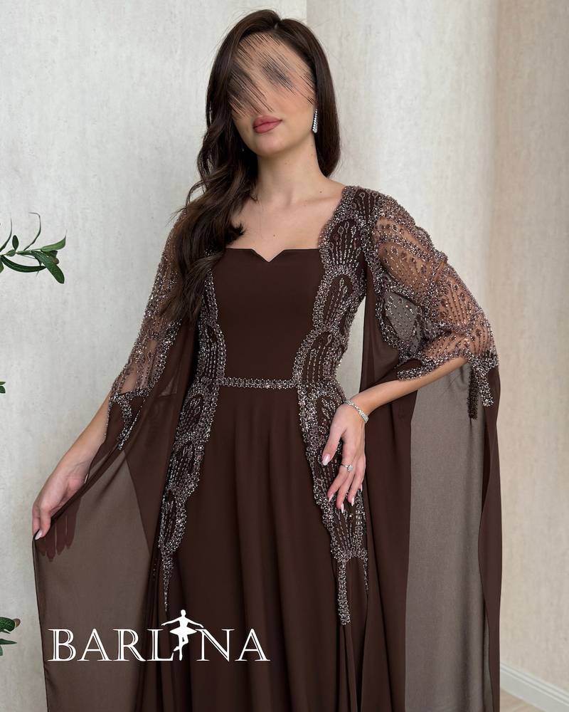Long brown dress with a sheer cape