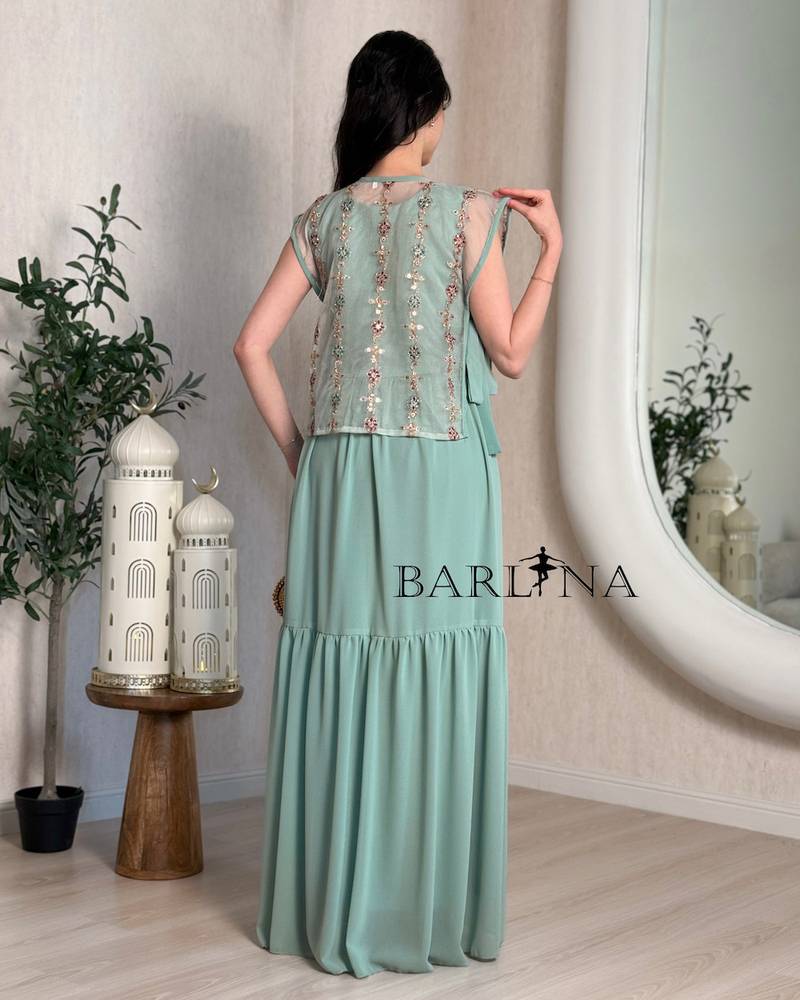 A luxurious jalabiya with an embroidered layer and a traditional touch.