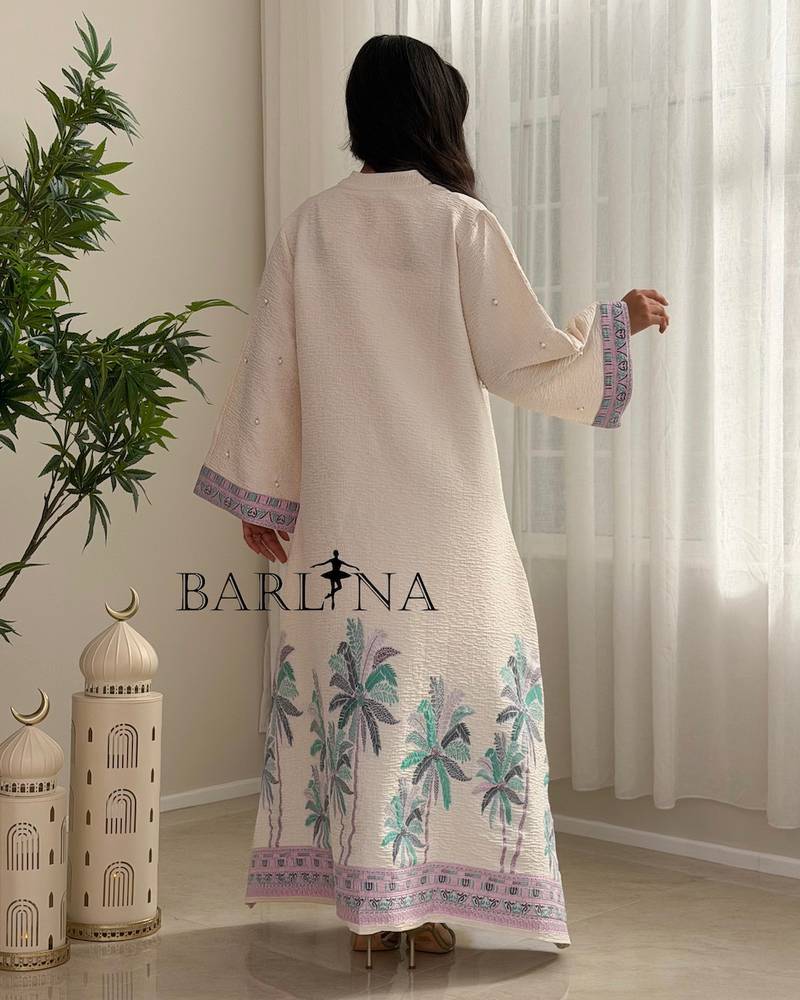 Ivory-colored jalabiya decorated with palm tree embroidery