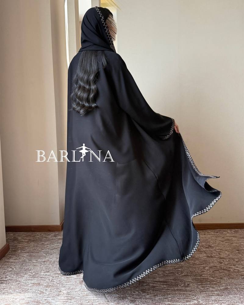 Black abaya with geometric embroidery on the edges