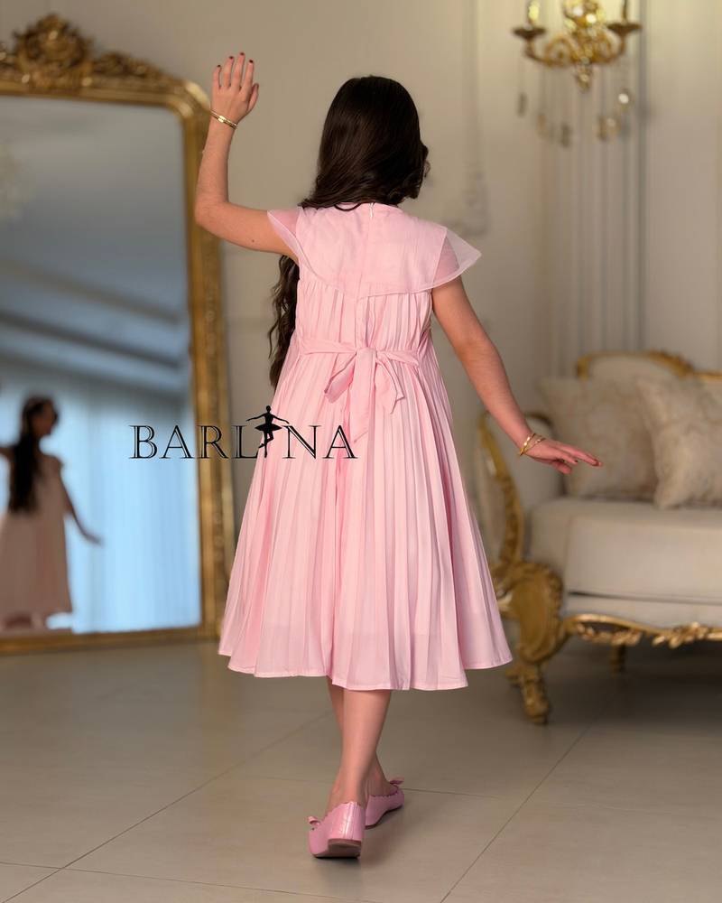 A soft girl's dress with floral embroidery