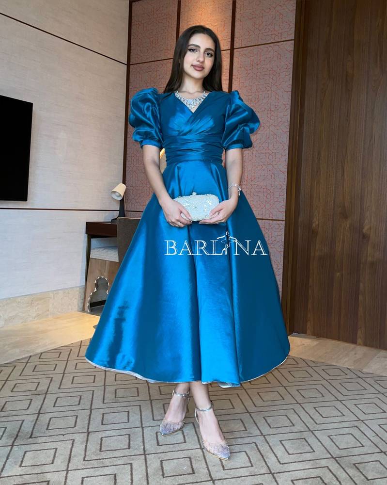 Blue midi dress with puff sleeves