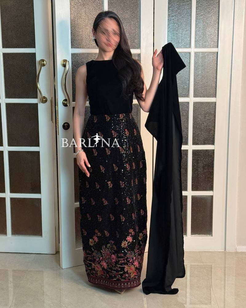 Luxurious black jalabiya with a velvet scarf