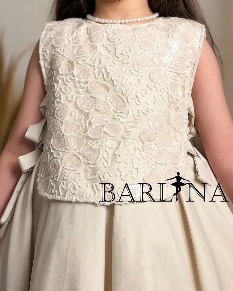 Elegant beige girls' dress with side tie