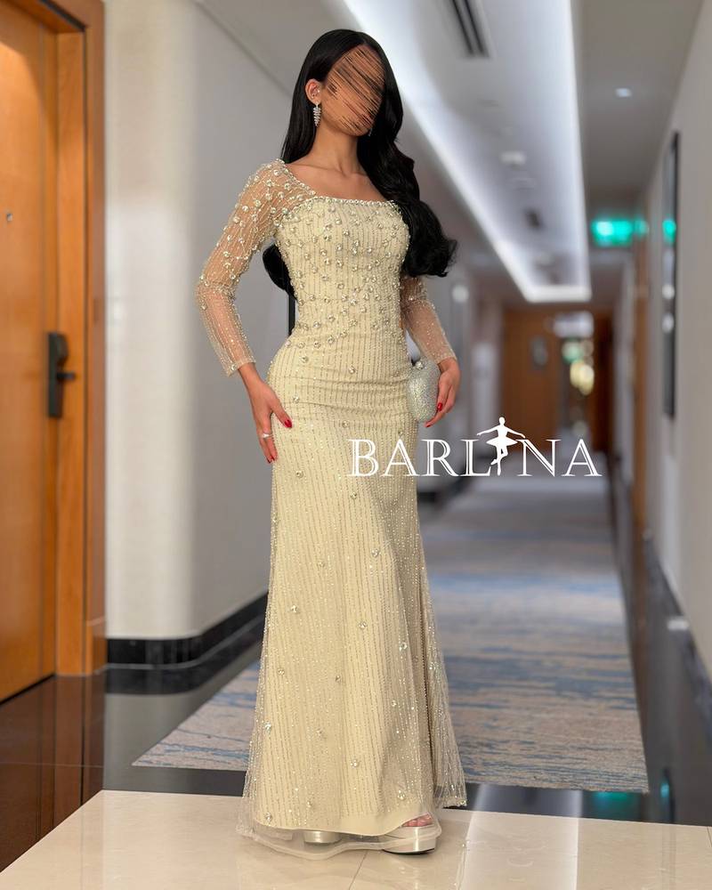 Crystal-embroidered evening dress with sheer sleeves