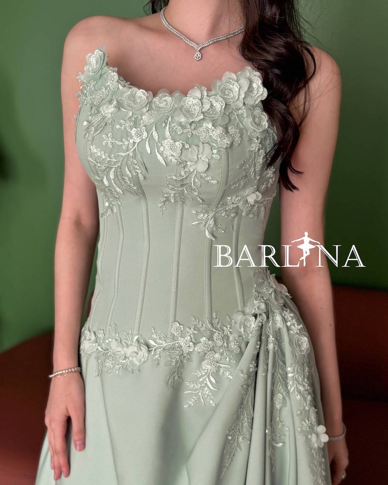 Pistachio green dress with a gathered waist design