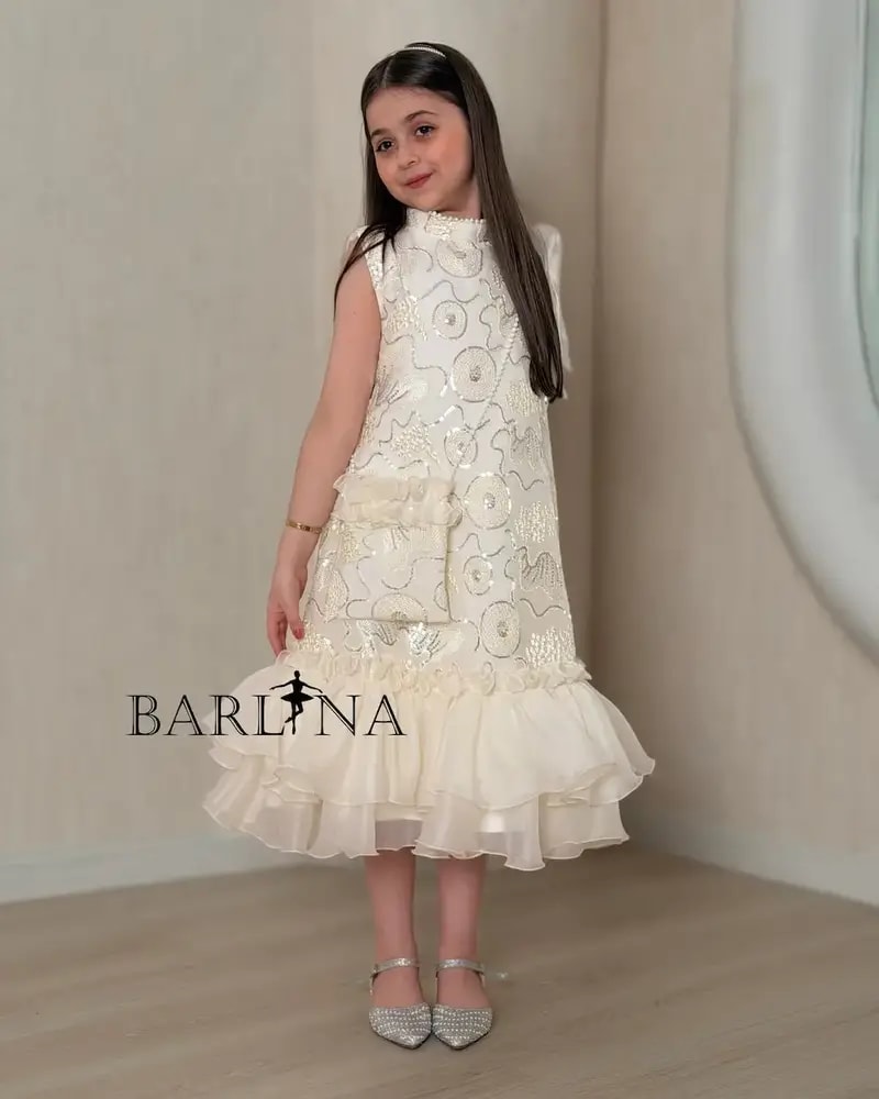Girls' embroidered dress with ruffles at the bottom