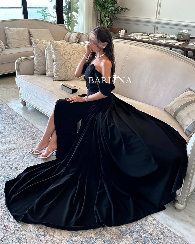 Black off shoulder dress with long tail