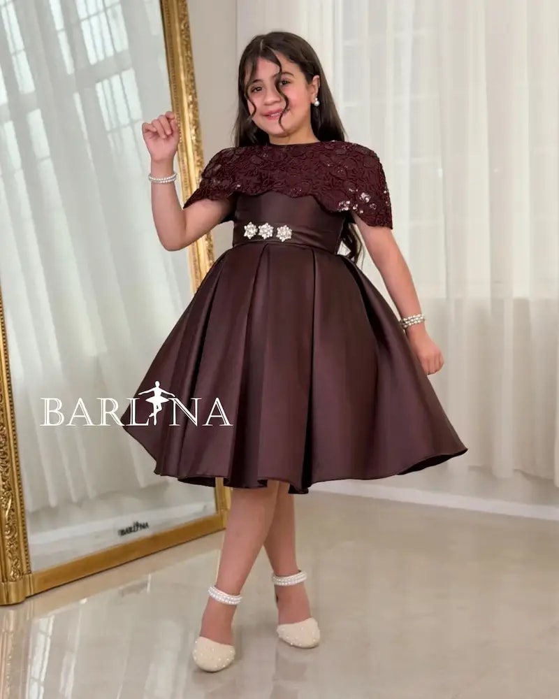 Elegant girls' dress with embellished shoulders