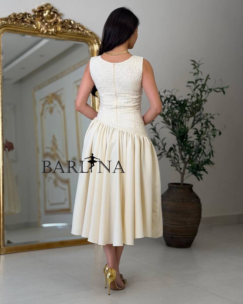 Soft midi dress with a sequined bodice