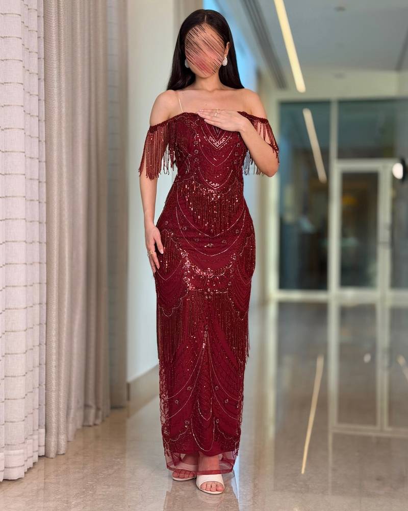 Elegant burgundy evening dress with dangling beads