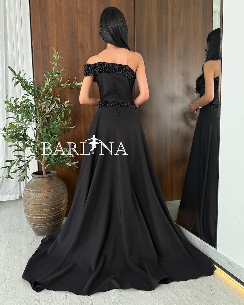 Black one-shoulder dress with pearl embroidery