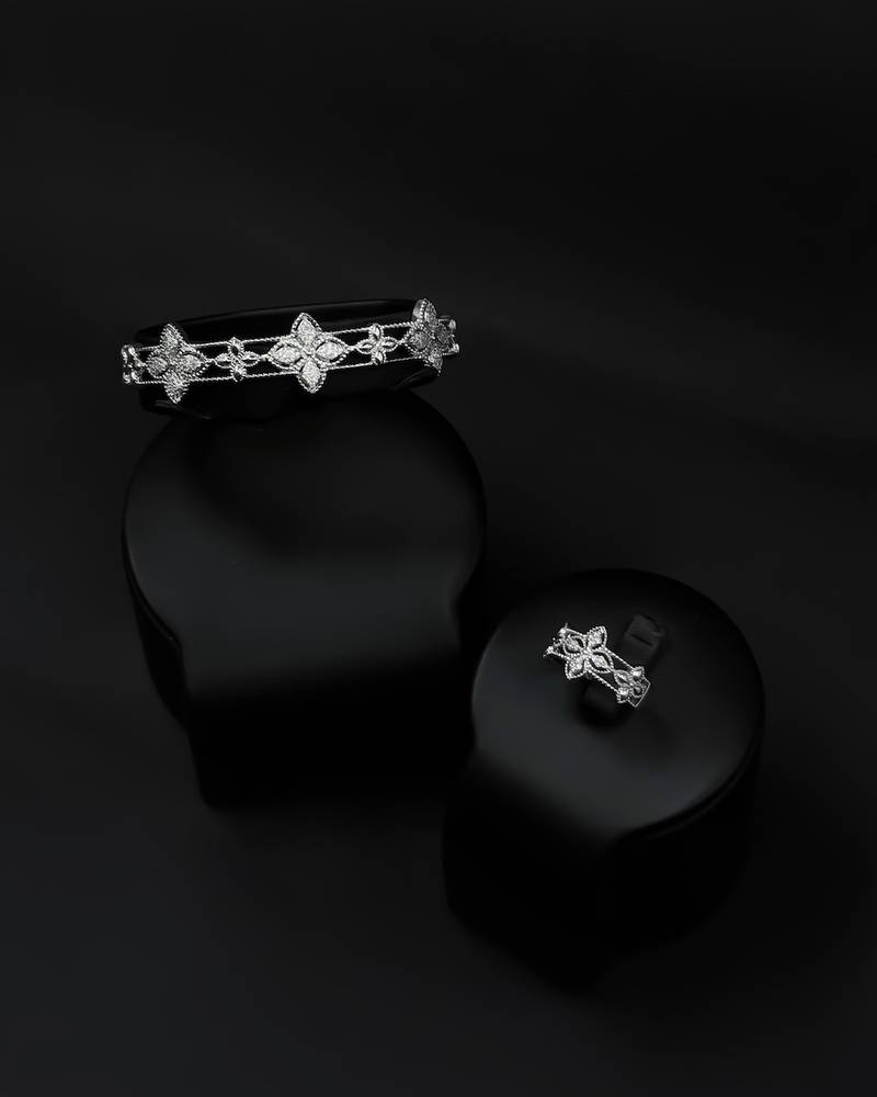 Bracelet and ring set with a rose-inspired design