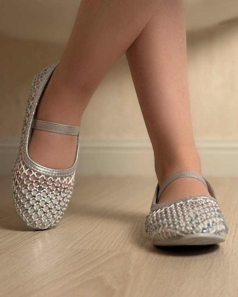 Soft girls' shoes adorned with sparkling crystals