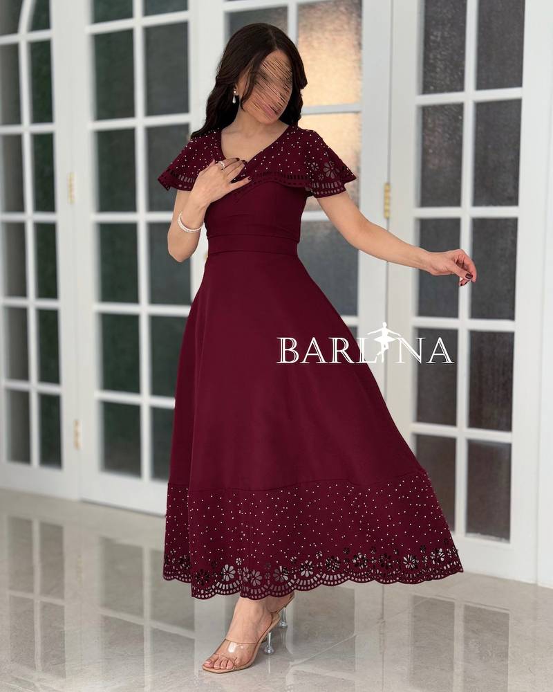 Burgundy dress with embroidery on the bodice and hem