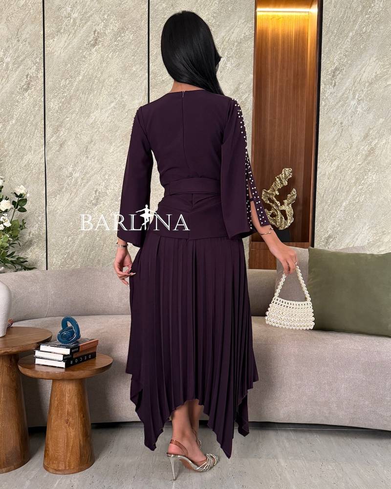 Dark purple dress with pearl embellished sleeves