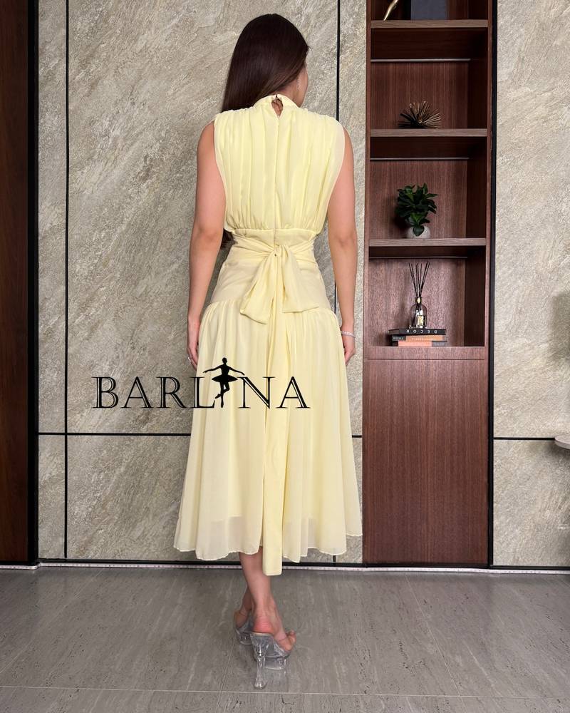 Pastel yellow dress with tie at the back