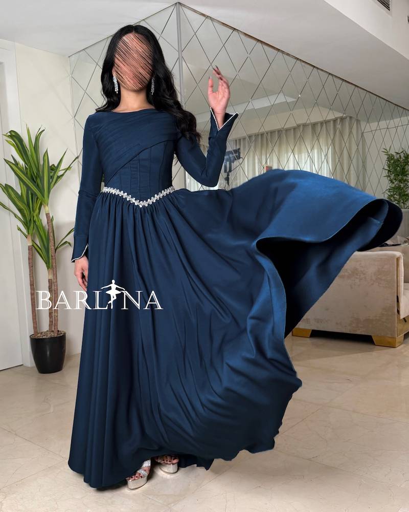 Long-sleeved petroleum-colored dress