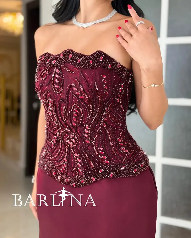 Burgundy evening dress with an embroidered corset design