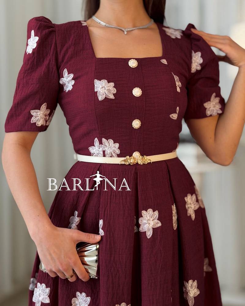 Burgundy midi dress adorned with white embroidery