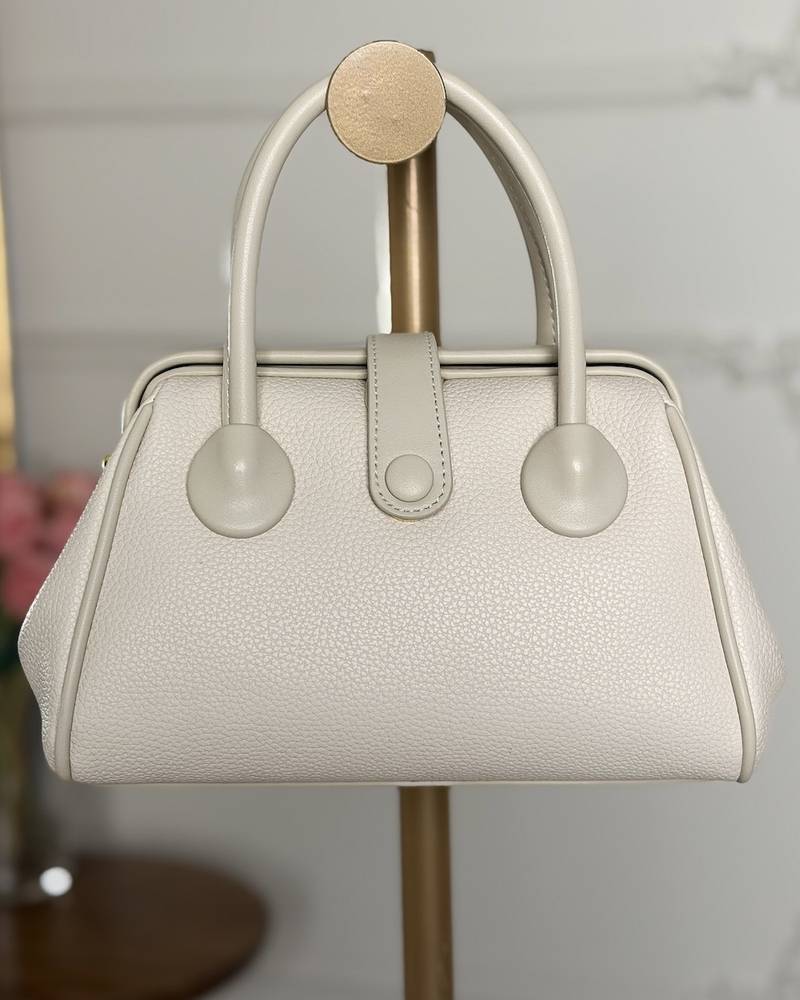 Handbag with a sleek design and stylish top handle