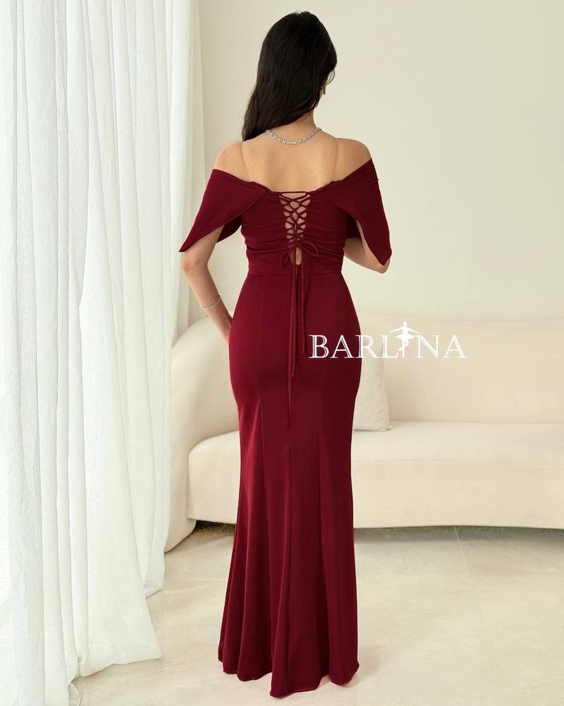 A soft burgundy dress with wide draped shoulders