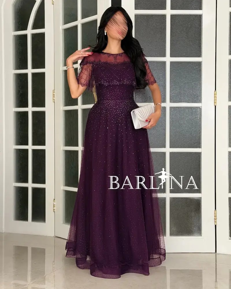 Purple tulle evening dress decorated with sequins