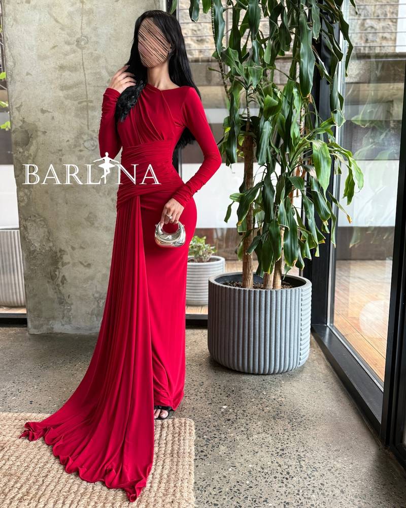 Long red draped dress with an extended tail