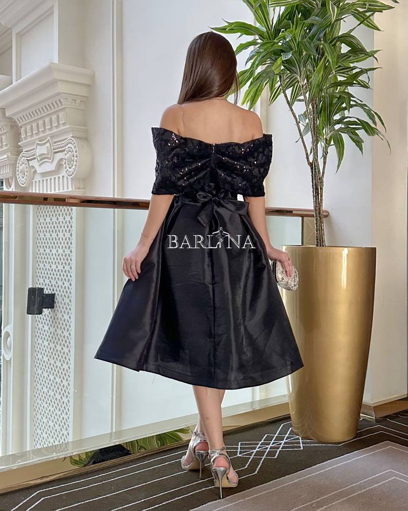 Black dress with embroidered bow